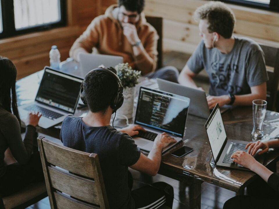 A distributed product engineering team collaborating inside a Global Capability Center office in India